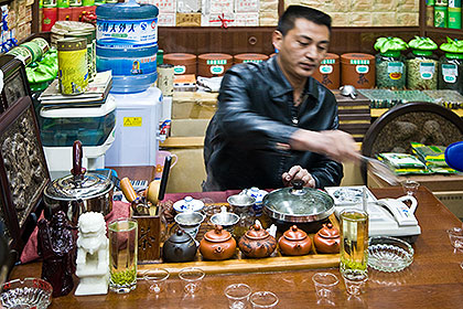Tea shop keeper making tea